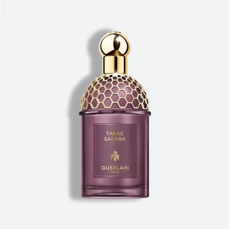 زجاجة عطر تاباك صحارى من جيرلان باريس باللون البنفسجي وغطاء ذهبي مزخرف